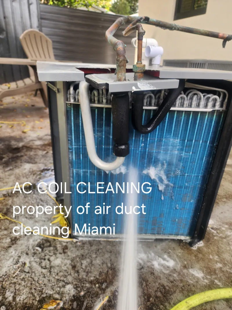 AC cleaning service technician performing coil and ac duct cleaning in Miami home