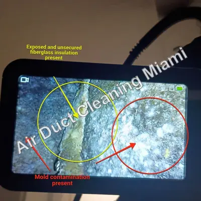 Duct camera inspection screen showing signs of mold and loose fiberglass inside an air duct